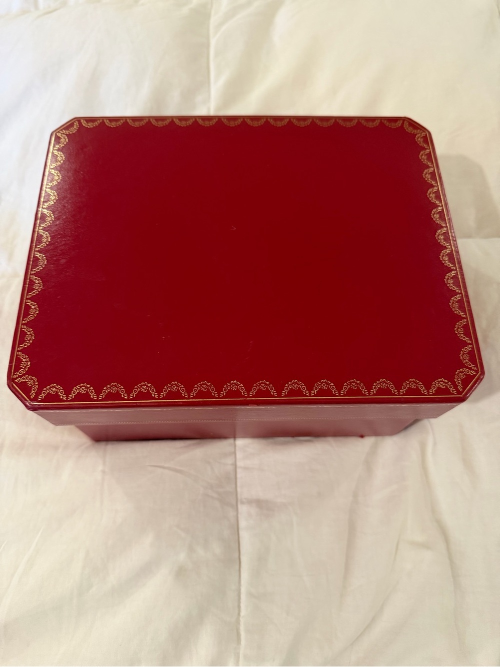 Cartier red jewelry box with gold trim